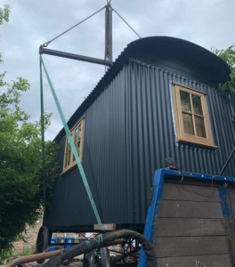 Shepherds hut being lifted